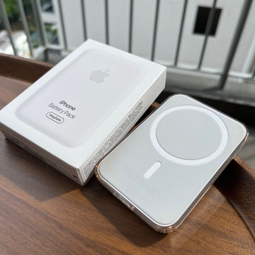AdiMagsafe iPhone Battery Pack on a wooden surface with packaging