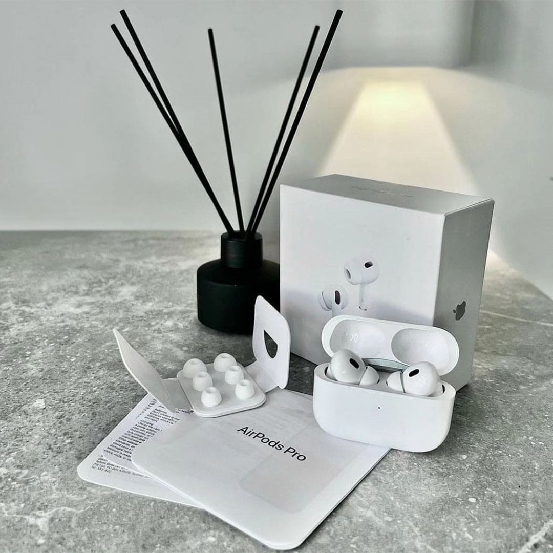 Adipods Pro 2 with packaging on a gray surface