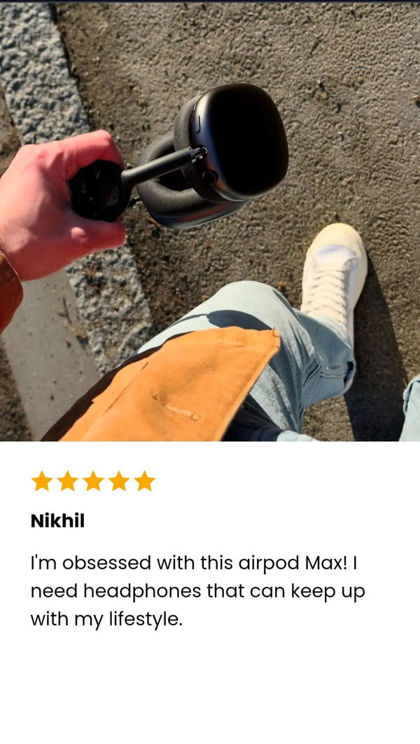 Person holding a black The AdiStore Adi Max (ANC) on a sidewalk with a five-star rating and review text.
